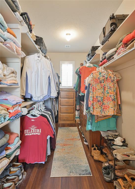 spacious closet featuring wood finished floors