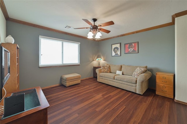 living room with visible vents, dark wood-style flooring, and ornamental molding