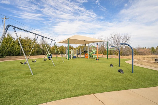 community jungle gym with a lawn