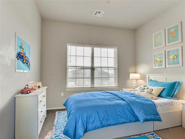 carpeted bedroom with baseboards and visible vents