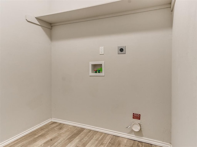 laundry area with washer hookup, light wood finished floors, hookup for an electric dryer, laundry area, and baseboards