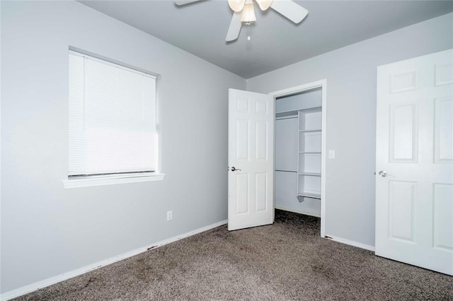 unfurnished bedroom featuring a ceiling fan, carpet, a closet, and baseboards