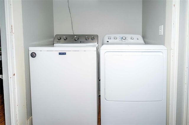 laundry room with laundry area and separate washer and dryer