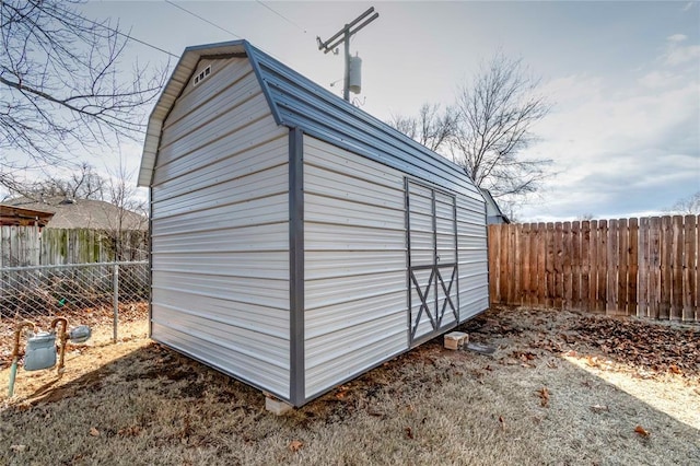 view of shed with a fenced backyard