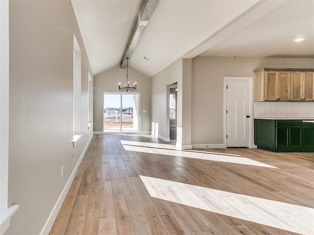 interior space featuring visible vents, baseboards, lofted ceiling with beams, light wood-style flooring, and an inviting chandelier