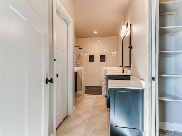 full bathroom with built in shelves, walk in shower, vanity, and recessed lighting