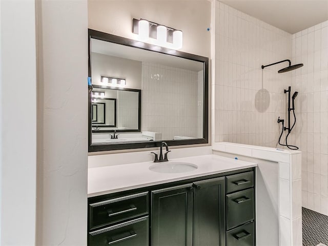 bathroom with walk in shower and vanity