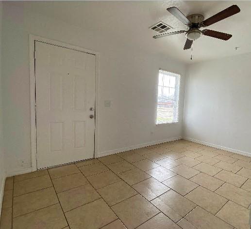 944 SE 14th St, Oklahoma City, OK 73129 - spare room featuring visible vents, ceiling fan, and baseboards