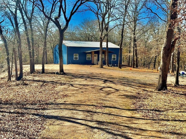 view of front of property featuring metal roof