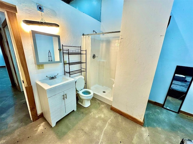 bathroom with a stall shower, baseboards, unfinished concrete flooring, a textured wall, and vanity