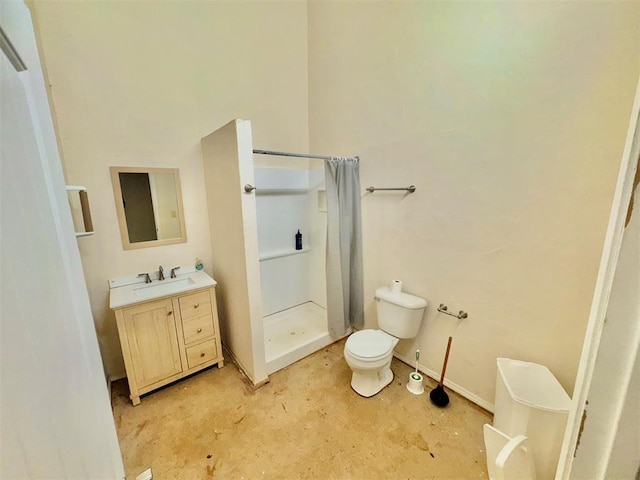 bathroom with concrete flooring, vanity, a shower stall, and toilet