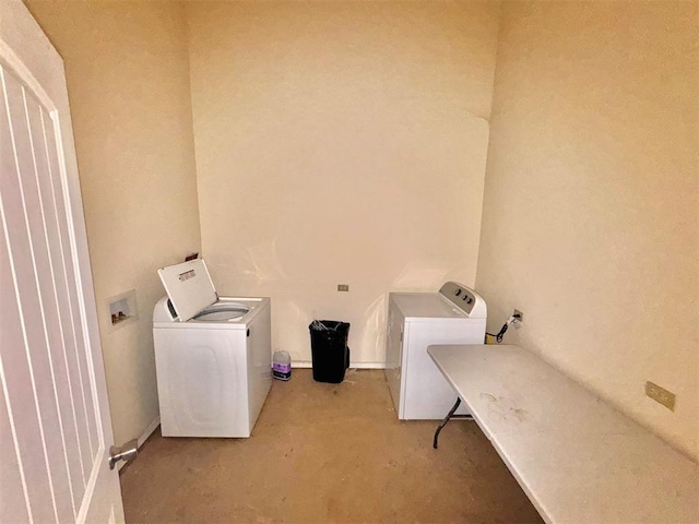 washroom featuring washing machine and dryer and laundry area