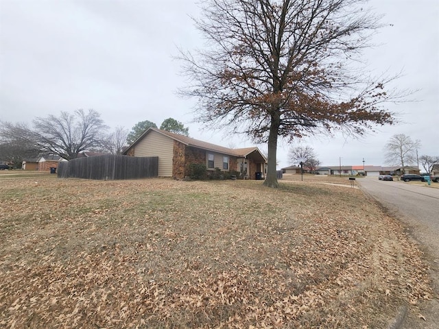 view of property exterior featuring fence