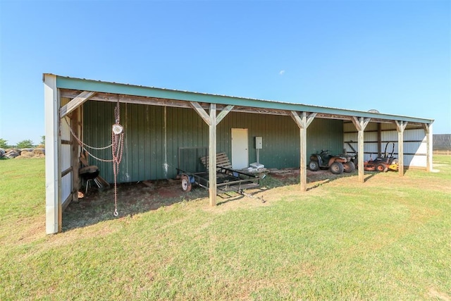 view of outbuilding featuring an exterior structure, a carport, and an outdoor structure