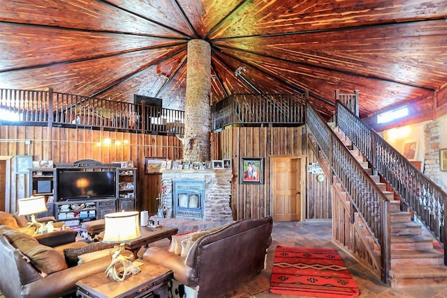 living room with high vaulted ceiling, wooden ceiling, and wood walls