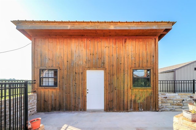 view of outdoor structure featuring fence