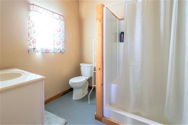 bathroom with toilet, finished concrete flooring, baseboards, and vanity