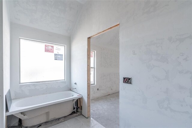 bathroom featuring a freestanding tub