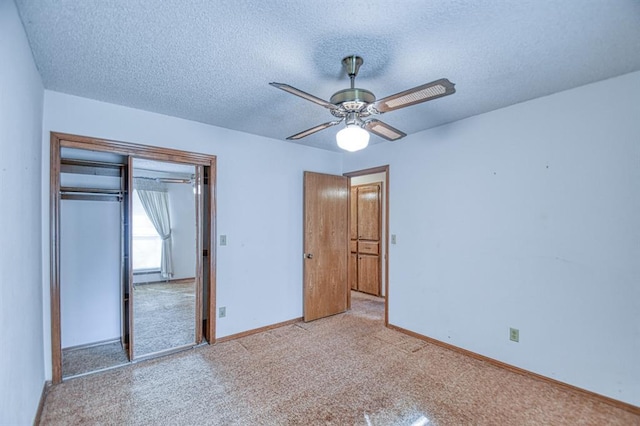 unfurnished bedroom featuring ceiling fan, baseboards, carpet, a closet, and a textured ceiling