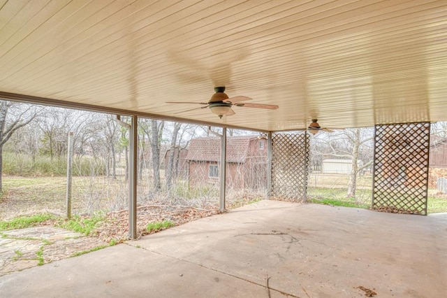 view of patio featuring fence and ceiling fan