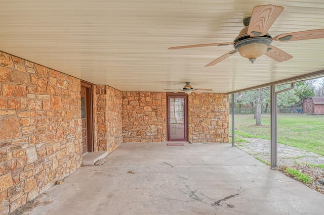 view of patio with a ceiling fan and fence