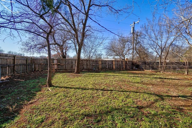 view of yard with a fenced backyard