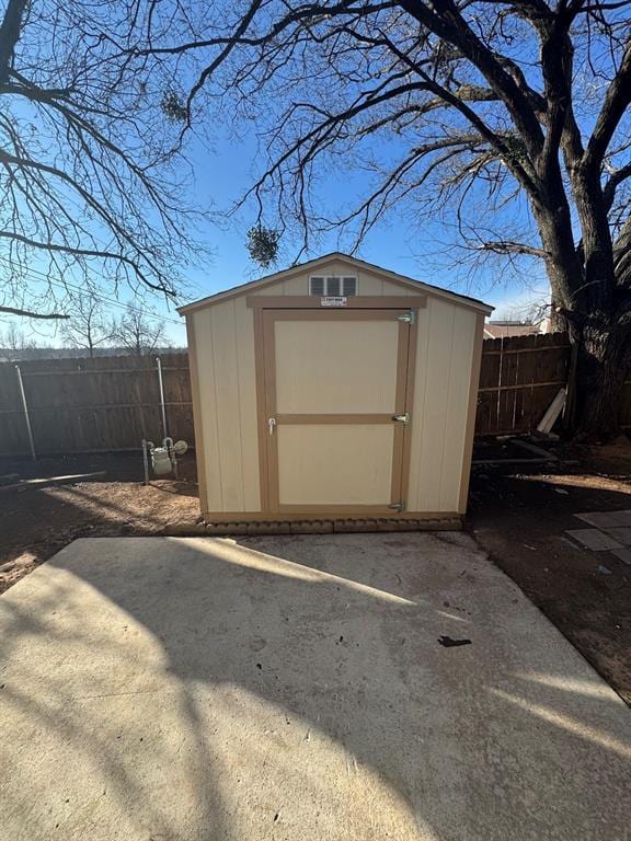 view of shed with a fenced backyard