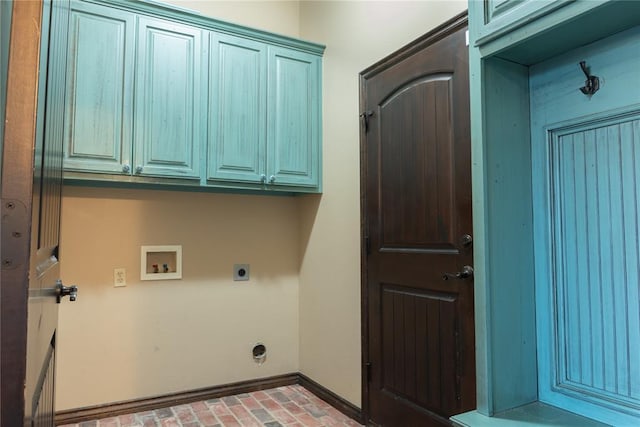 laundry area featuring cabinet space, baseboards, hookup for a washing machine, brick floor, and hookup for an electric dryer