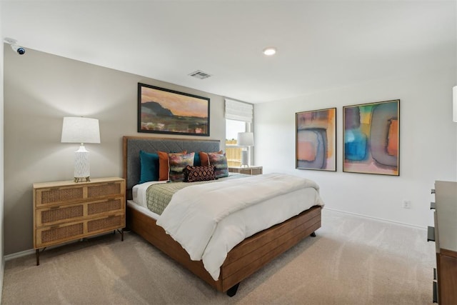 bedroom with carpet, visible vents, and baseboards