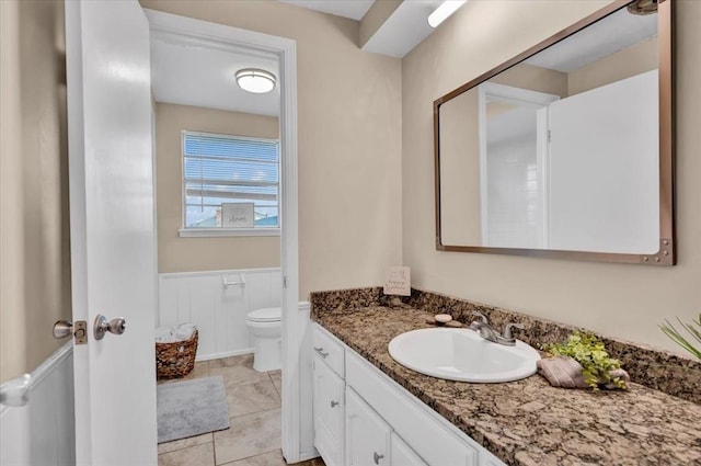 bathroom with toilet and vanity