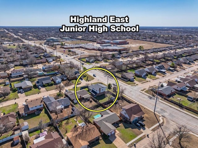 birds eye view of property with a residential view