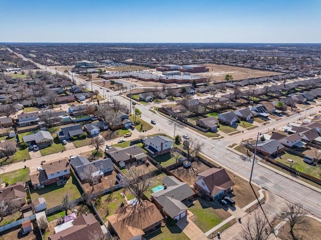 birds eye view of property with a residential view