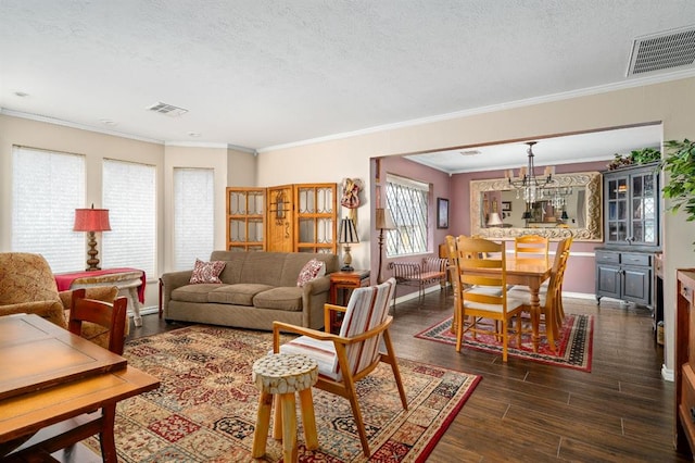 living area with visible vents, a textured ceiling, and dark wood-style floors