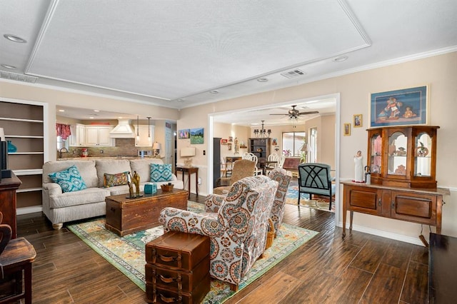 living room with visible vents, a ceiling fan, and dark wood-style flooring