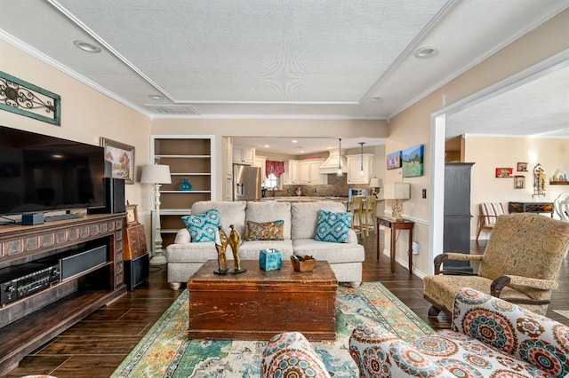 living area featuring dark wood-style floors, built in features, recessed lighting, and crown molding