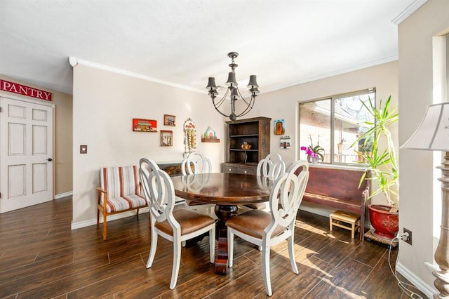 dining room with a notable chandelier, baseboards, dark wood-type flooring, and ornamental molding