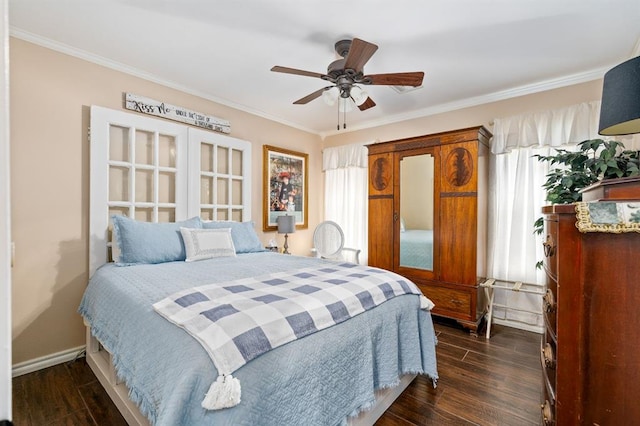 bedroom featuring dark wood-type flooring, a ceiling fan, baseboards, and ornamental molding