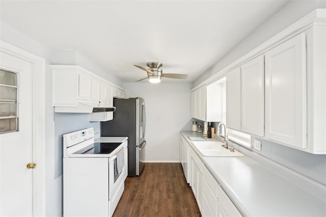 kitchen featuring light countertops, white cabinetry, a sink, and white electric range oven