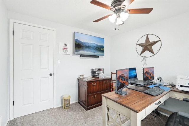 office area with ceiling fan and light colored carpet