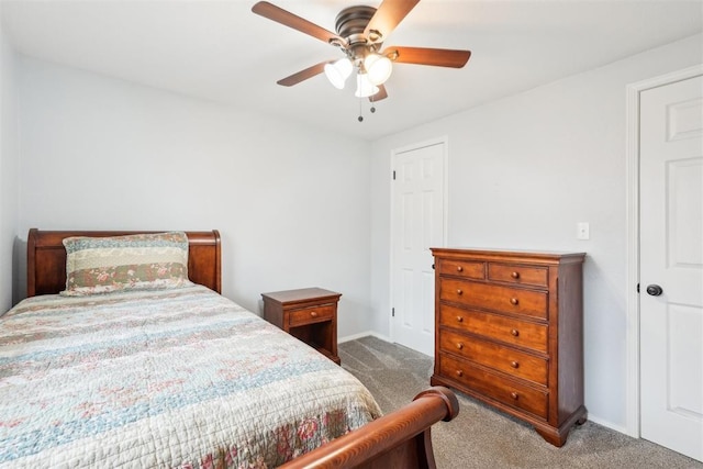 bedroom with carpet floors, a ceiling fan, and baseboards