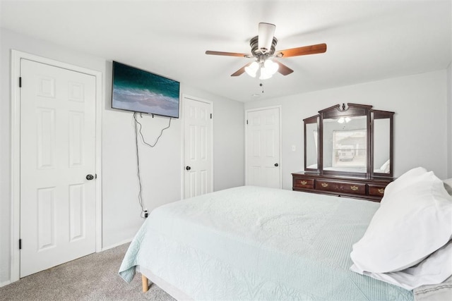 carpeted bedroom featuring a ceiling fan