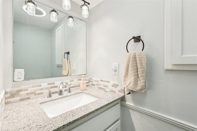 bathroom with backsplash and vanity