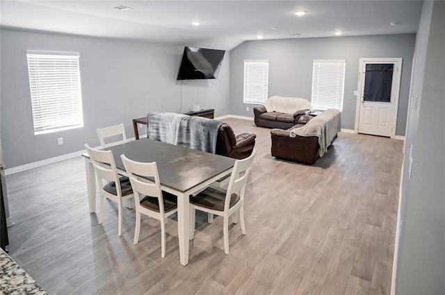 dining room with light wood finished floors, visible vents, baseboards, and recessed lighting