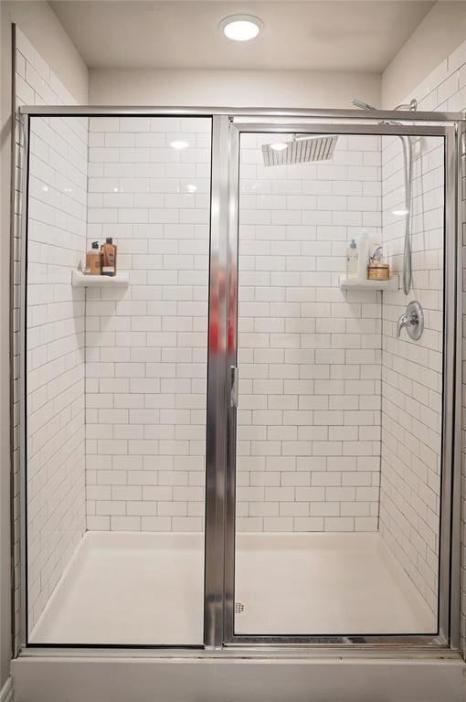 full bath with a shower stall