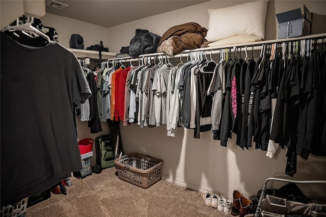 walk in closet featuring carpet floors and visible vents