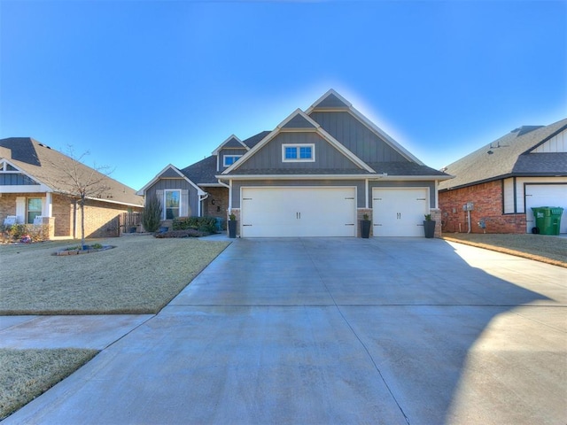 craftsman-style home featuring an attached garage, fence, board and batten siding, and driveway