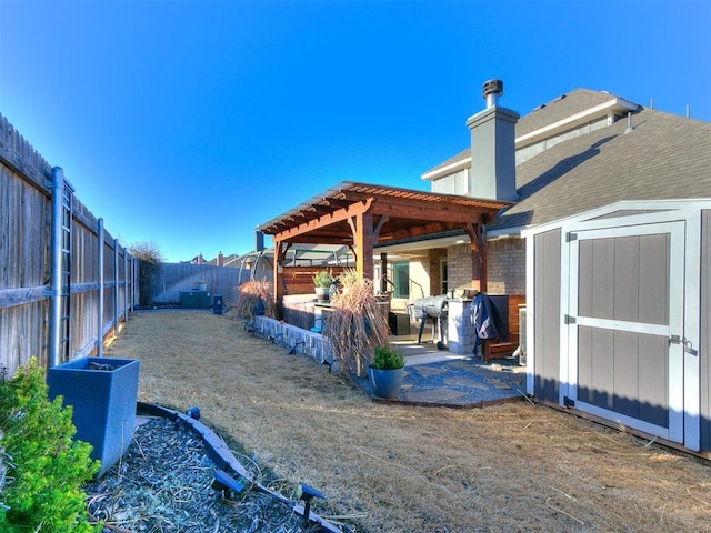 back of property featuring a pergola, a patio, a fenced backyard, a storage shed, and an outdoor structure