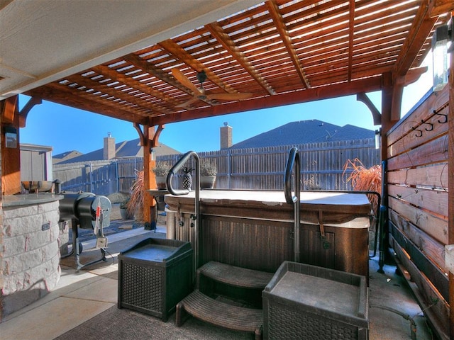 view of patio with a fenced backyard, a pergola, and a hot tub