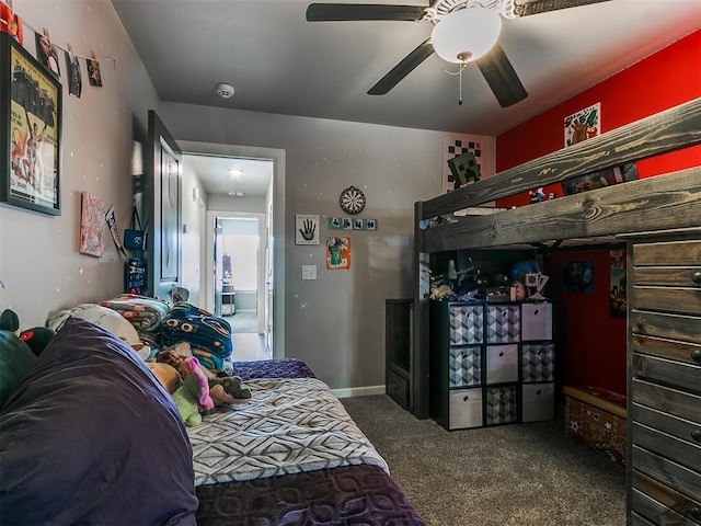 carpeted bedroom with baseboards and a ceiling fan