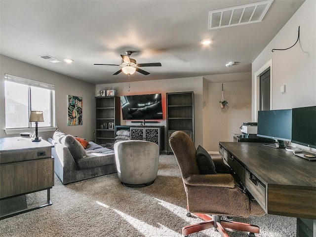 carpeted living area with visible vents, recessed lighting, and ceiling fan